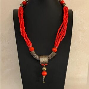 Vintage ethnic red-orange beaded and wrapped brass tone wire necklace